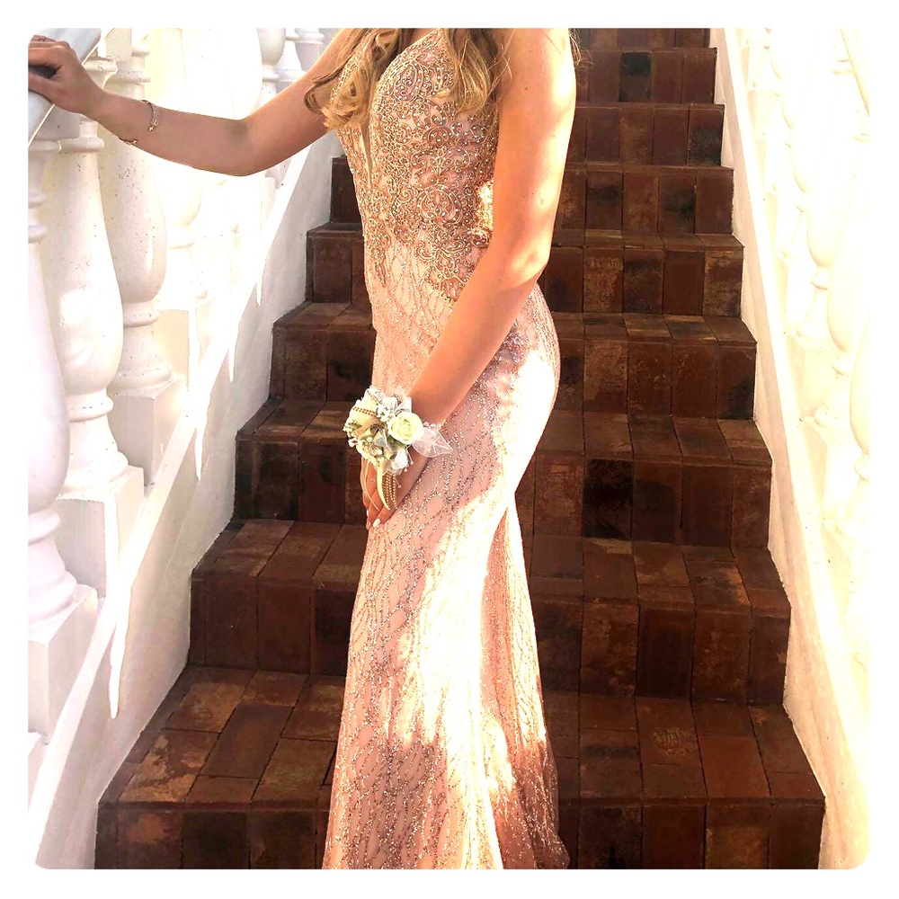 Light pink/tan with gold design prom dress.
